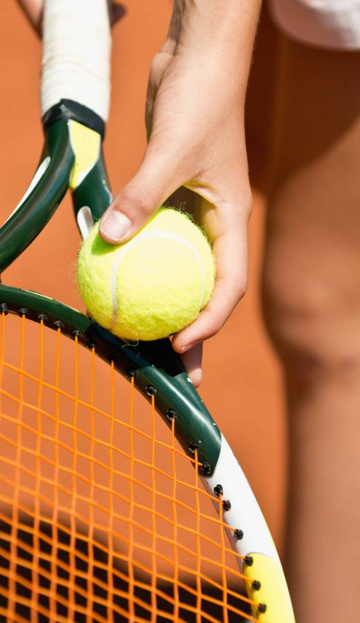 Female tennis player serving